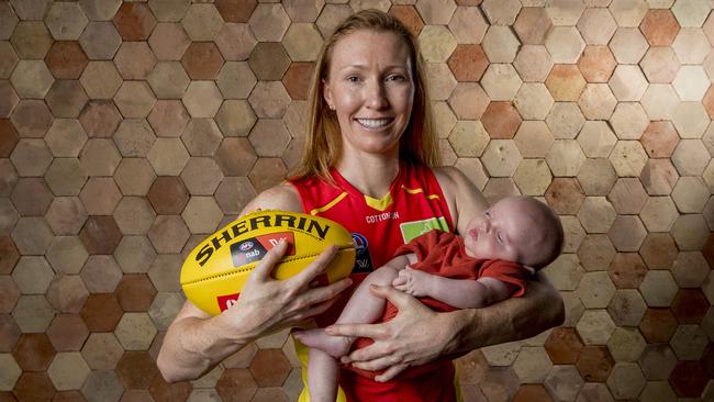 Gold Coast Suns AFLW player and maternity doctor, Tiarna Ernst, holding Rome Falchi. Picture: Jerad Williams