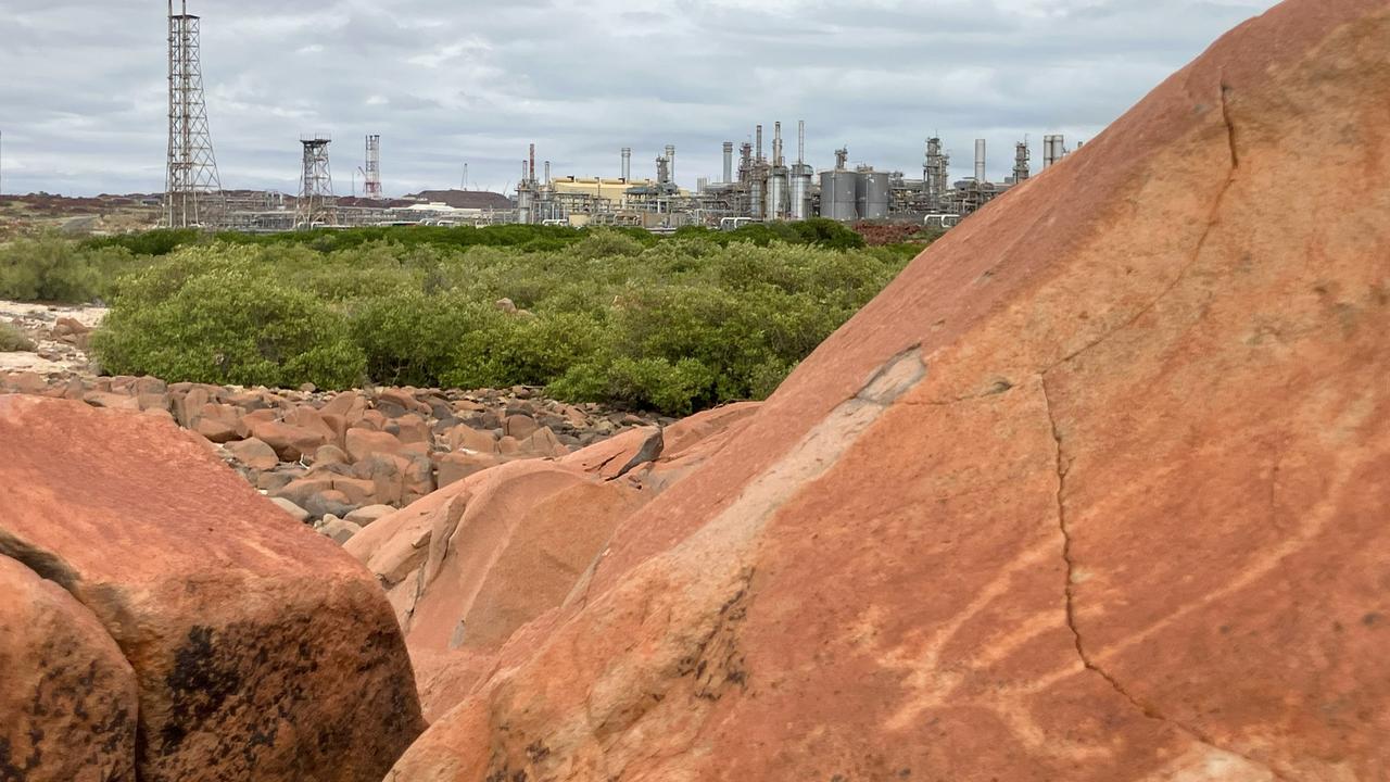 A turtle carved into rocks at Murujuga where Woodside operate the North West Shelf gas facility. Picture: Save Our Songlines