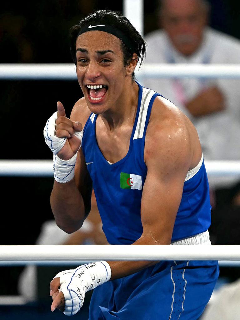 Khelif dances after her semi-final win. Photo by Mauro PIMENTEL / AFP