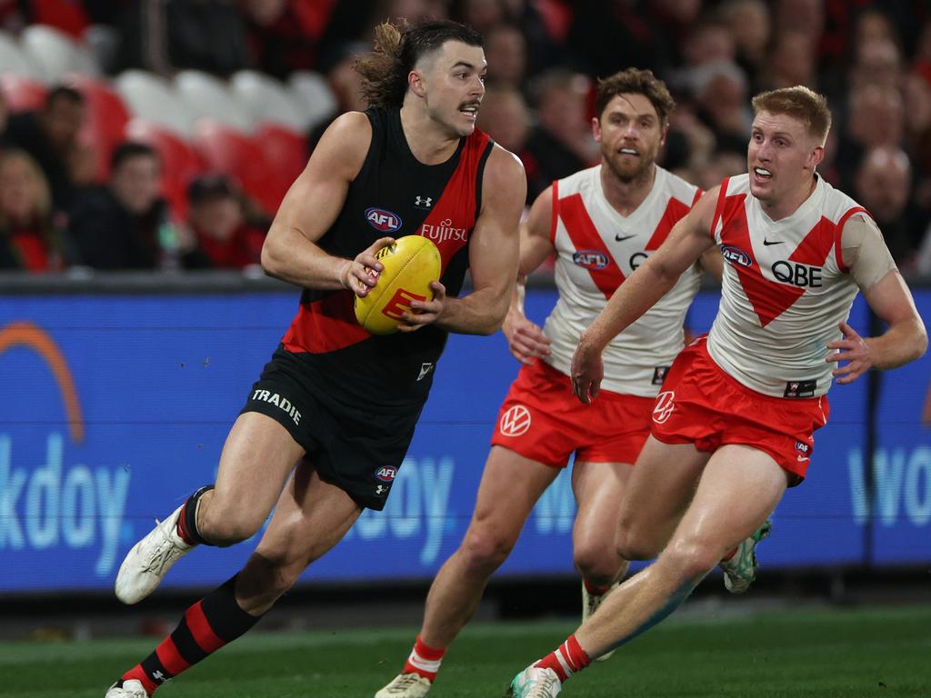 Sam Draper tries to get away from Matt Roberts and Dane Rampe. Picture: Daniel Pockett/Getty Images