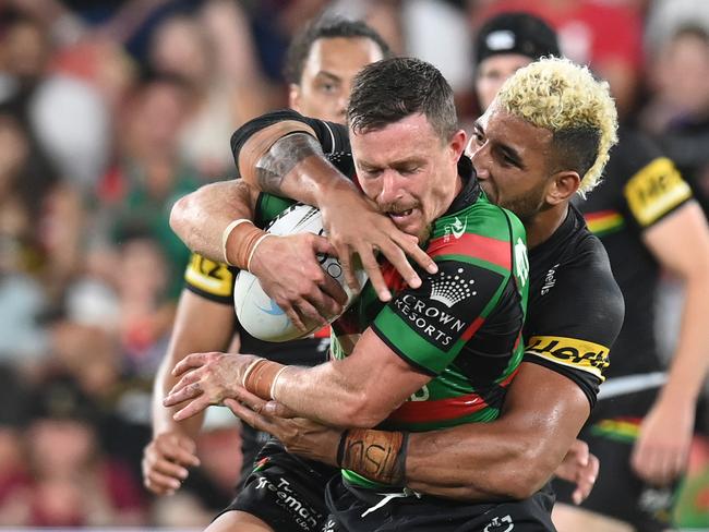 BRISBANE, AUSTRALIA - OCTOBER 03:  Damien Cook of the Rabbitohs is tackled during the 2021 NRL Grand Final match between the Penrith Panthers and the South Sydney Rabbitohs at Suncorp Stadium on October 03, 2021, in Brisbane, Australia. (Photo by Bradley Kanaris/Getty Images)