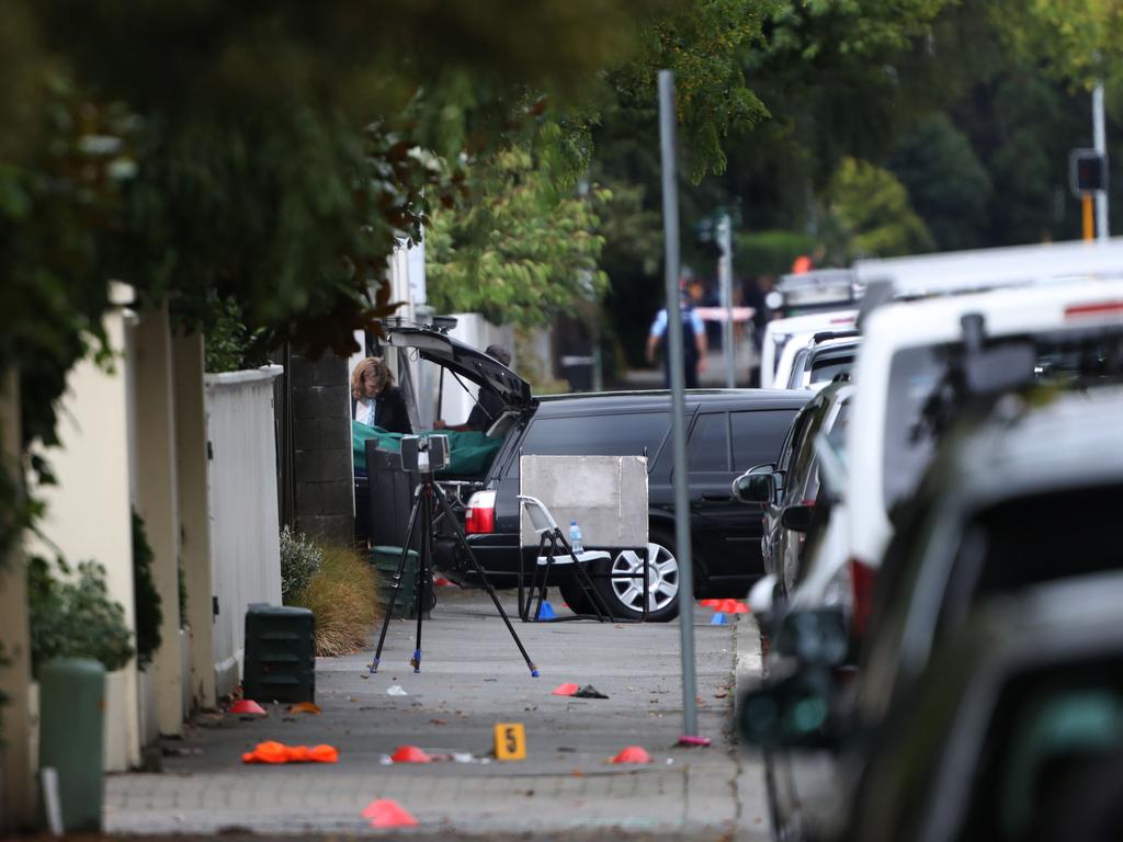 Police have begun the ugly task of removing the bodies from the mosque. The bodies were loaded into hearses. Picture Gary Ramage