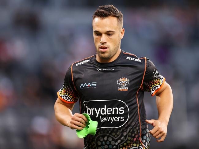 SYDNEY, AUSTRALIA - MARCH 12:  Luke Brooks of the Tigers runs during the warm-up before the round one NRL match between the Wests Tigers and the Melbourne Storm at CommBank Stadium, on March 12, 2022, in Sydney, Australia. (Photo by Mark Kolbe/Getty Images)