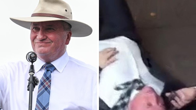 Nationals MP Barnaby Joyce caught on video lying on a Braddon street while swearing on the phone.