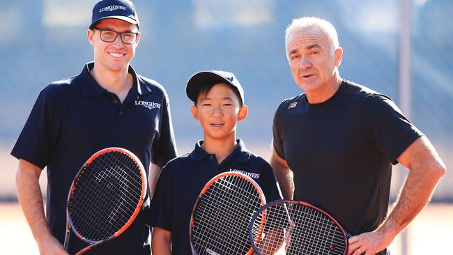Jeremy Jin, 12, future prospect for Australian Tennis, with (L) coach Simon Ede and Australian legend Wally Masur (R). Picture: Mark Evans
