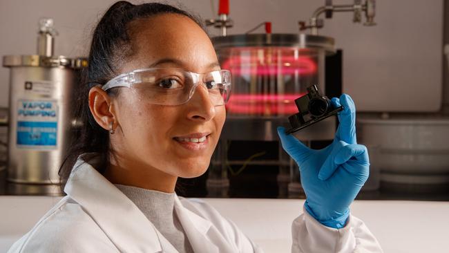 UniSA researcher Dr Melanie MacGregor in her laboratory at the Future Industries Institute with a small device for testing urine to detect bladder cancer. Picture: Matt Turner