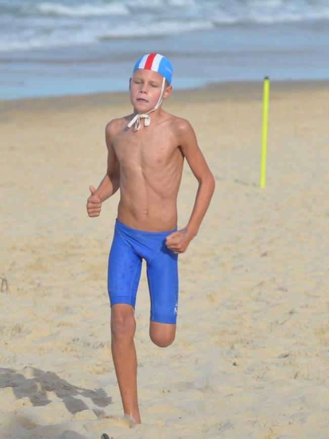 Running action at the Queensland Youth Surf Life Saving Championships on February 17.