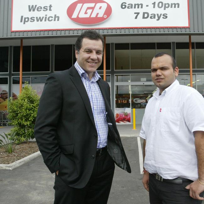 Charter Hall development manager Brendan Cannon with Gaurav Bansal at the opening of Mr Bansal’s first IGA at West Ipswich in 2010.