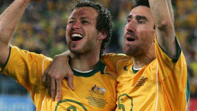 SYDNEY, NSW - NOVEMBER 16:  Lucas Neill #2 and Tony Vidmar #5 for the Socceroos celebrates after winning the second leg of the 2006 FIFA World Cup qualifying match between Australia and Uruguay at Telstra Stadium November 16, 2005 in Sydney, Australia.  (Photo by Robert Cianflone/Getty Images)