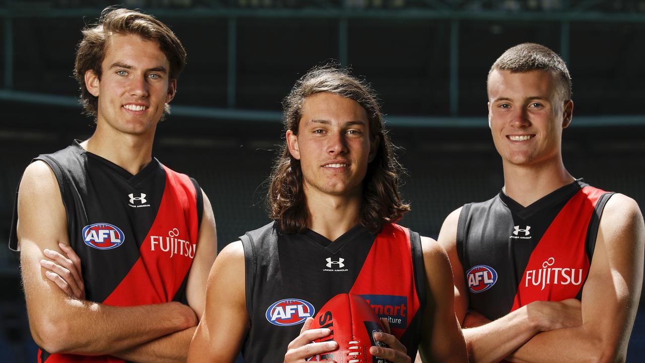 Zach Reid, Archie Perkins and Nik Cox after being drafted in 2020. (Photo by Dylan Burns/AFL Photos via Getty Images)