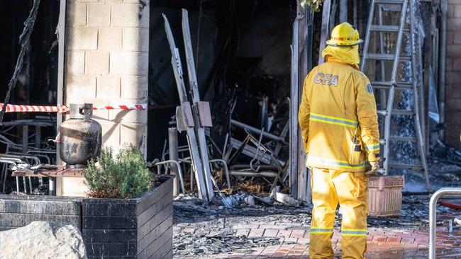 Firefighters attend the scene where multiple properties were destroyed by fire in Gilbert Street, Torquay. Picture: Brad Fleet