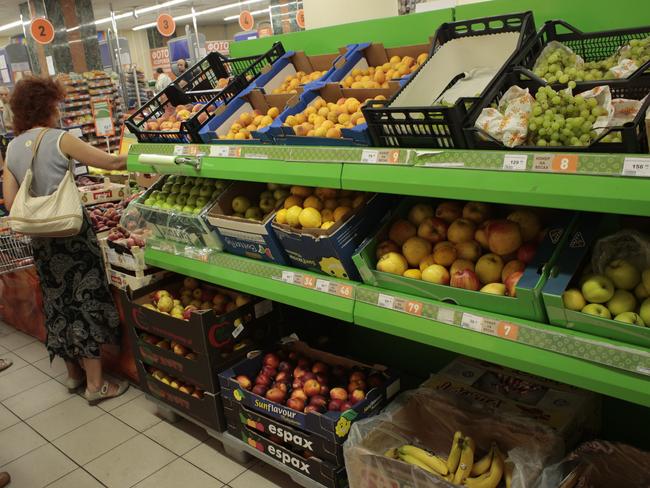 People buy imported fruit at a supermarket in Moscow yesterday. Picture: Ivan Sekretarev