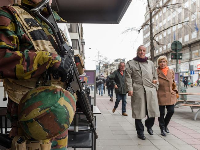 Armed patrols Belgian Army soldiers patrol a street in the centre of Brussels. Salah Abdeslam, a French national who lived in Molenbeek, Belgium, is currently the subject of an international manhunt. Source: AP