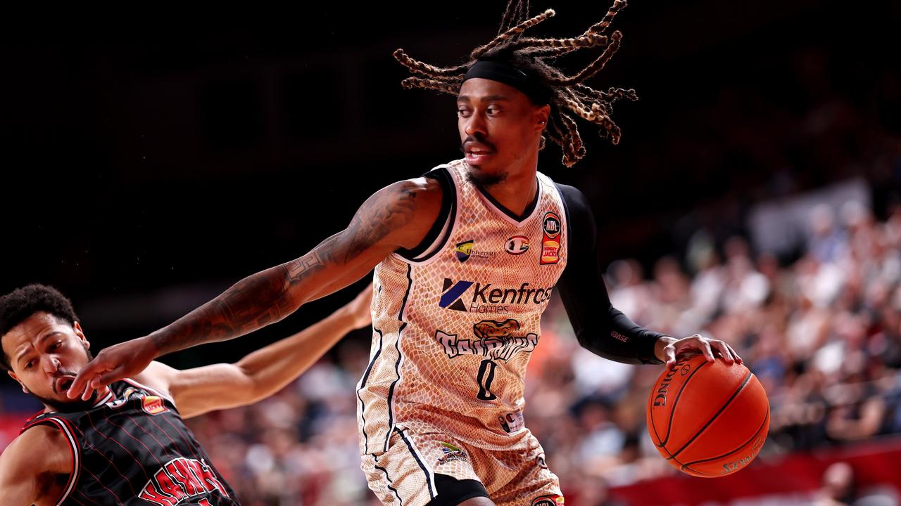 WOLLONGONG, AUSTRALIA - JANUARY 18: Tahjere McCall of the Taipans is challenged by Tyler Harvey of the Hawks during the round 16 NBL match between Illawarra Hawks and Cairns Taipans at WIN Entertainment Centre, on January 18, 2024, in Wollongong, Australia. (Photo by Mark Metcalfe/Getty Images)