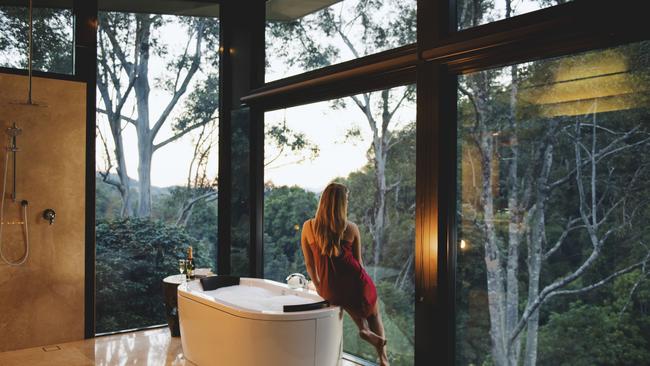 Baths with a dreamy view are one of the drawcards for couples at Crystal Creek Rainforest Retreat in the Tweed Valley