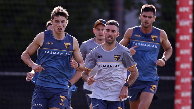 Hawthorn assistant Kade Simpson joins in the running at training. Picture by Michael Klein