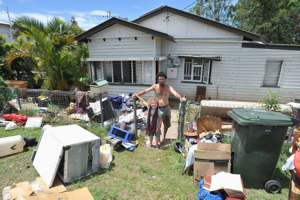 Maryborough floods - Craig Lawrence and 7 yr old Skye Edgerton at his home on Mary Street at The Pocket. Floodwaters came through his house to about a metre. Photo: Alistair Brightman / Fraser Coast Chronicle. Picture: Alistair Brightman