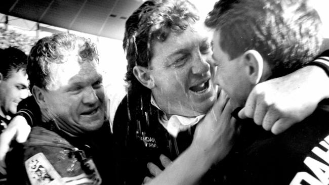 Phil Gould is hugged by Brad Izzard (L) Greg Alexander after Penrith’s 1991 triumph.