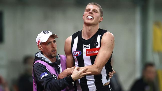 Will Kelly nurses his injured elbow after hurting it on debut for Collingwood. Picture: Ryan Pierse/Getty Images