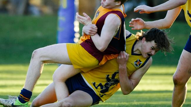 Scotch’s Zac Becker tackles St Michael’s opponent Mitch Guidera in a match last season. Picture: AAP/Morgan Sette