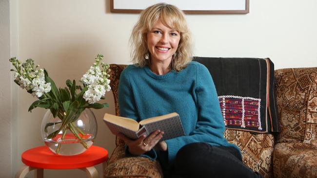 Actress Michelle Langstone at home in Woollahra with her favourite thing — a cloth-covered hardcover book. Pictures: Bob Barker.