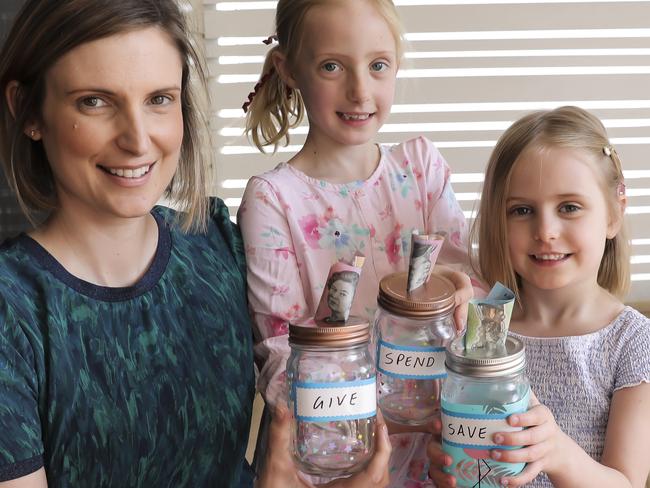 MoneysaverHQ cover pic : teaching your kids about money. Lisa Naumann, and her three kids: Anna (7), Madeleine (5), and Sam (2). Lisa is teaching her kids to save money and knows the importance of setting up good financial habits early. Pic Mark Cranitch.