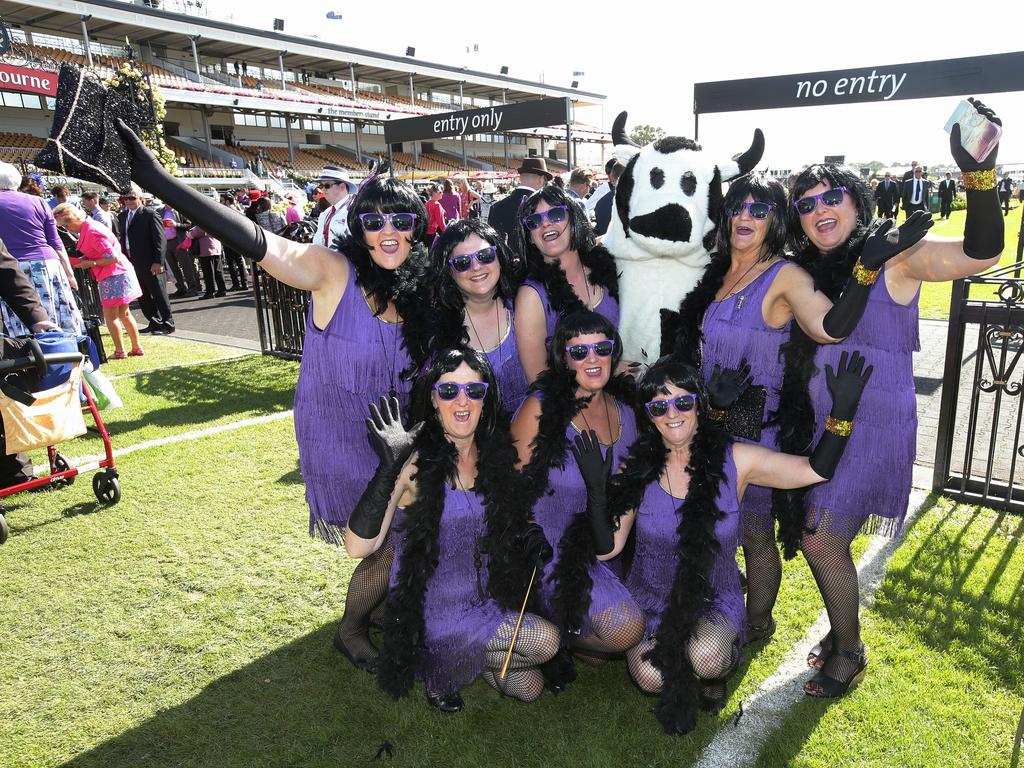 ‘Girls from the bush.’ Casterton girls dressed as The 20s with Sunrise Cash cow. Picture: Andrew Tauber