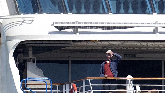 A Pacific Princess passenger looks out over Melbourne. Picture: Sarah Matray