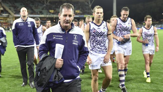 Ross Lyon walks off Adelaide Oval after Fremantle’s 100-point loss.