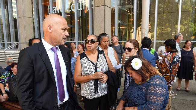 Leonie Duroux (right), the sister-in- law of murdered teenager Clinton Speedy-Duroux, speaks to former Detective Chief Inspector Gary Jubelin outside the Court of Criminal Appeal in Sydney on Thursday, Feb. 16, 2017.