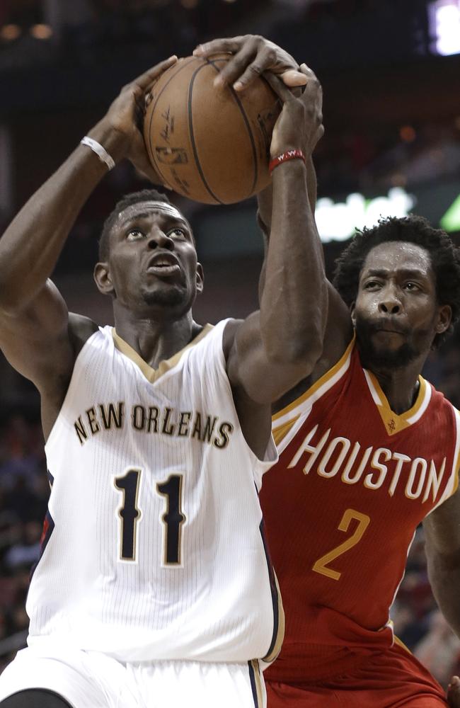 Houston Rockets' Patrick Beverley reaches in to knock the ball away.