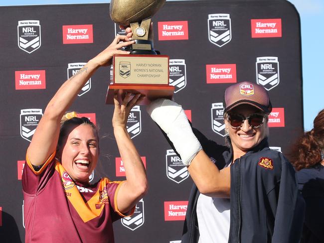 Raising the trophy with injured co-captain Ruan Sims. Pic: Mike Batterham