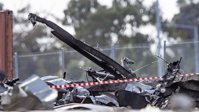 Fire Crews douse what looks like the fuselage after a light aircraft has crashed into DFO in Essendon. Picture: Jason Edwards