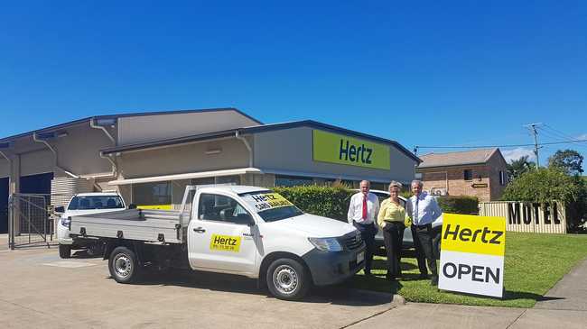 DRIVING A DEAL: Ray White Commercial Caloundra agents Len Greedy and Alan Gray with Hertz branch location manager Kim Steenbergen. Picture: Contributed