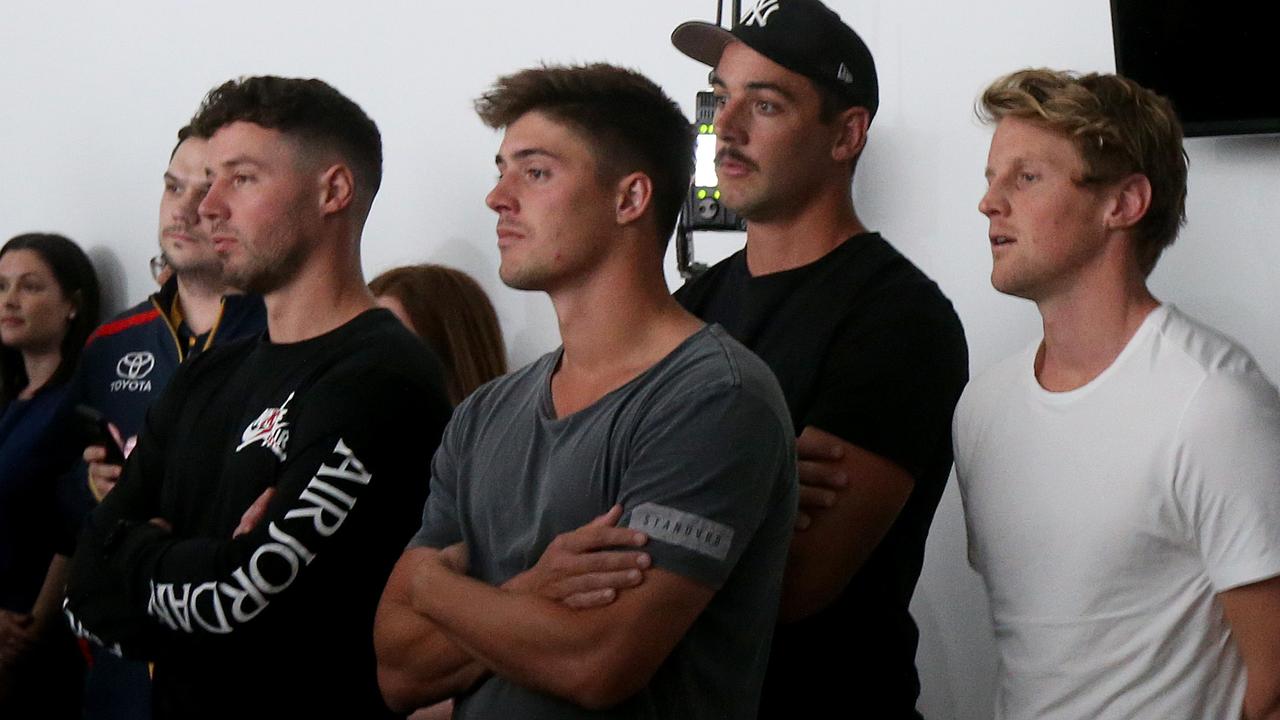 Players Luke Brown, Riley Brown, Taylor Walker and Rory Sloan look on during a press conference at the Crows headquarters in Adelaide, Tuesday, October 15, 2019. Matthew Nicks has been announced as new head coach of the Adelaide Crows. (AAP Image/Kelly Barnes) NO