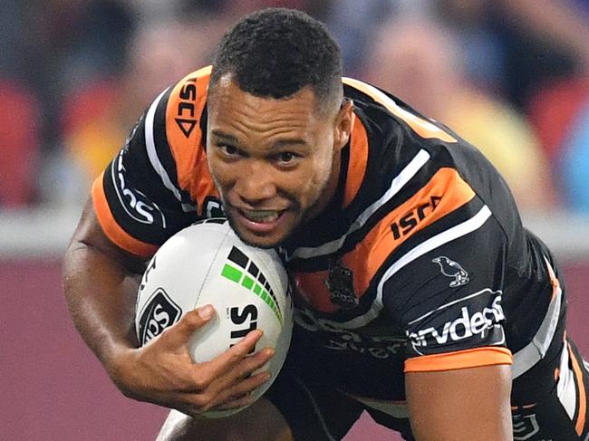 Moses Mbye of the Tigers scores a try during the Round 9 NRL match between the Wests Tigers and the Penrith Panthers at Suncorp Stadium in Brisbane, Friday, May 10, 2019.  (AAP Image/Darren England) NO ARCHIVING, EDITORIAL USE ONLY