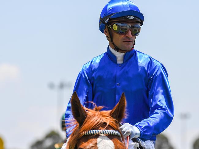 Jockey Corey Brown returns to scale on Condemned.