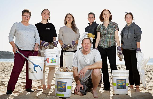 Kathy Griffin, Lily Kukulka, Nevena Krups, Caroline Batchler, Maria Atkins, Marie Rolfsmeier and Kobie Joyce (front) cleaning up Manly Beach for DoSomething Day 2018. Picture: Adam Yip