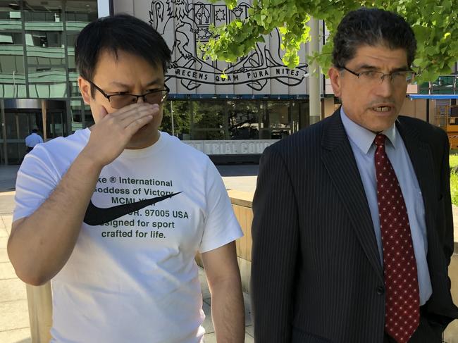 Liang Zhang, left, pictured besides his lawyer Dominic Oliveri and an unknown female supporter, leaves Parramatta District Court after pleading not guilty to dealing with the proceeds of crime in connection to what the AFP allege is a multi-million dollar money laundering plot.   PIC: Rhiannon Down / The Australian