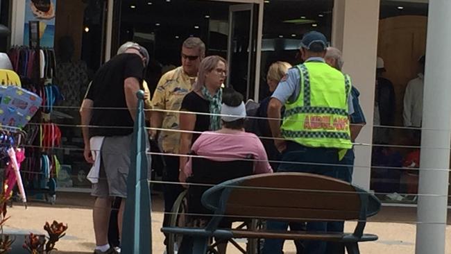 A woman receives medical attention after riding her electric hire bike straight into a barrier on Orchid Ave.