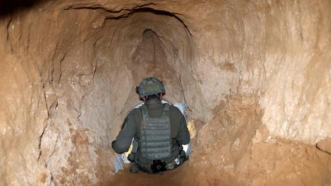 An Israeli soldier exits from a tunnel he army claimed was a “Hamas command tunnel” under a compound of the United Nations Relief and Works Agency for Palestine Refugees (UNRWA) in Gaza City. Picture: Jack Guez/AFP