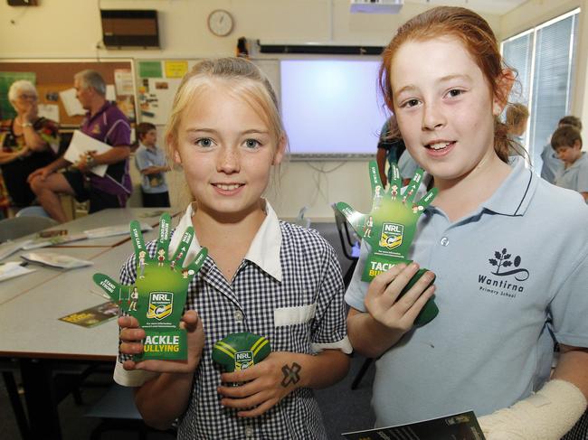 Melbourne Storm players visited Wantirna Primary School as part of a program to help spread anti-bullying message. Pictured are Shannon, 10, and Zoe, 9.