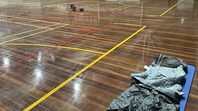 Evacuees slept on the floor of the basketball courts. Picture: Olivia Condous