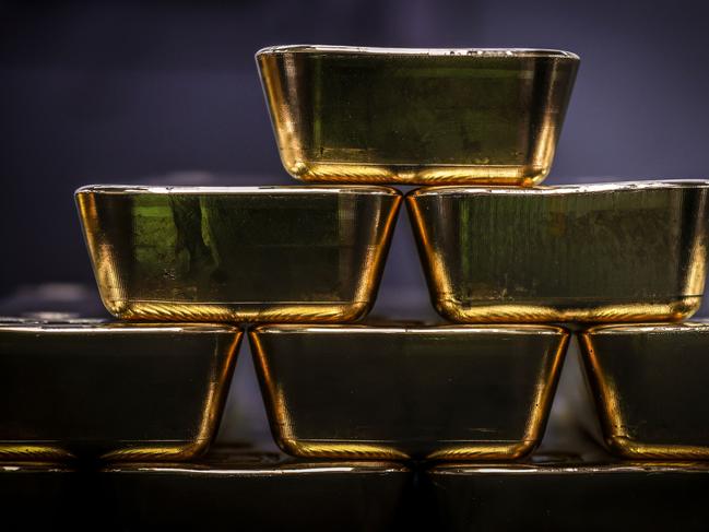 Gold bullion bars are pictured after being inspected and polished at the ABC Refinery in Sydney on August 5, 2020. - Gold prices hit 2,000 USD an ounce on markets for the first time on August 4, the latest surge in a commodity seen as a refuge amid economic uncertainty. (Photo by DAVID GRAY / AFP)