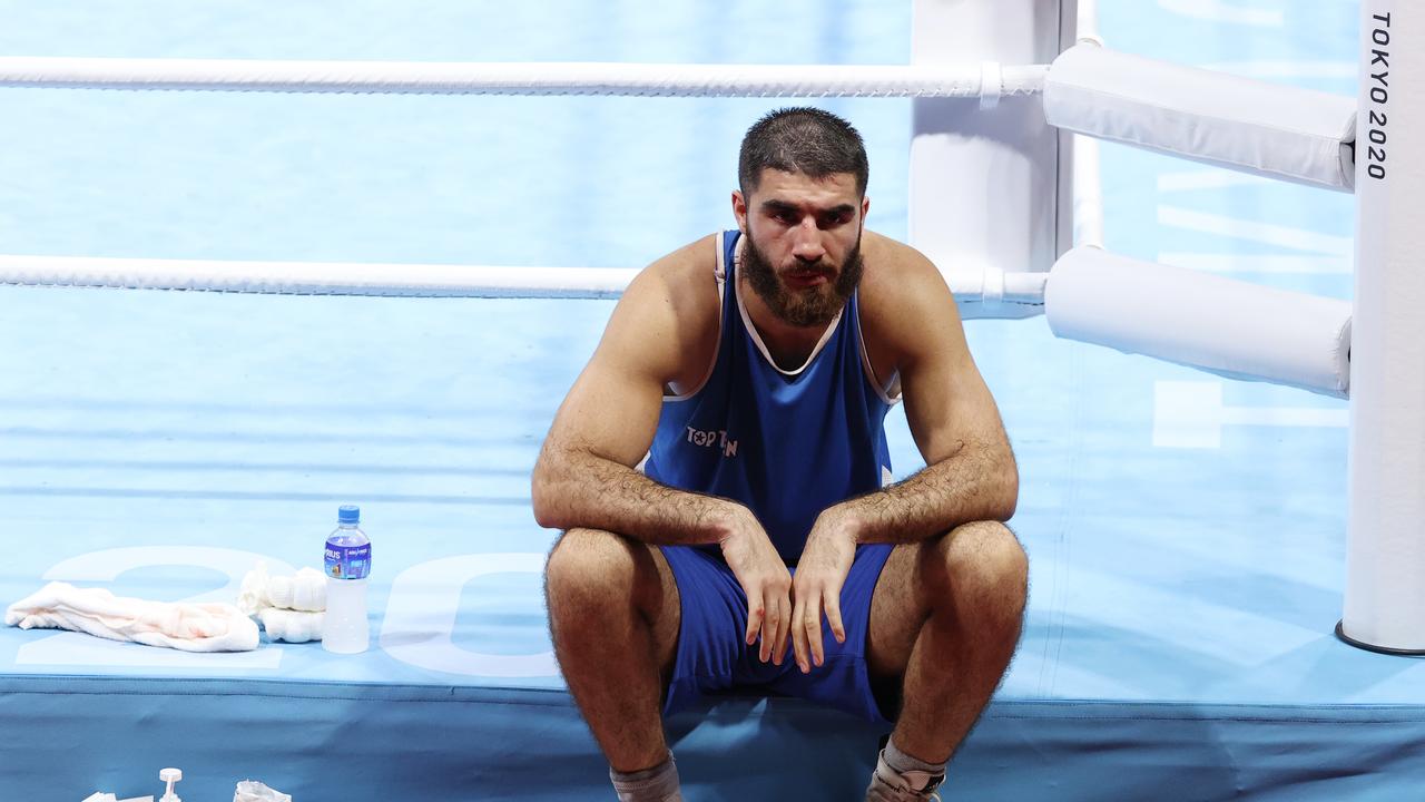 TOKYO, JAPAN - AUGUST 1, 2021: France's Mourad Aliev refuses to leave the ring after he was disqualified for headbutting Team GB's Frazer Clarke in a men's super heavyweight (+91kg) quarterfinal boxing bout at Kokugikan Arena during the 2020 Summer Olympic Games. Frazer was announced the winner. Valery Sharifulin/TASS (Photo by Valery Sharifulin\TASS via Getty Images)