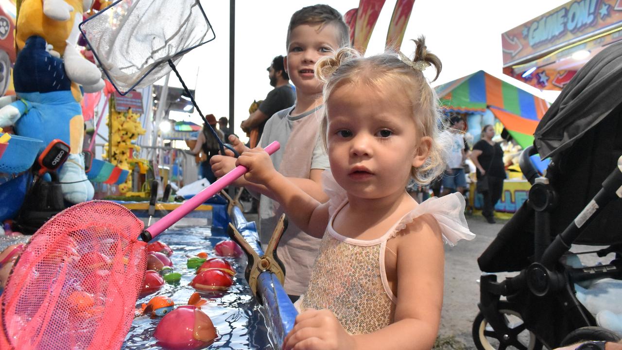 Joey and Maggie Jeffries of Cannonvale trying thier luck in sideshow alley on Friday. Picture: Kirra Grimes