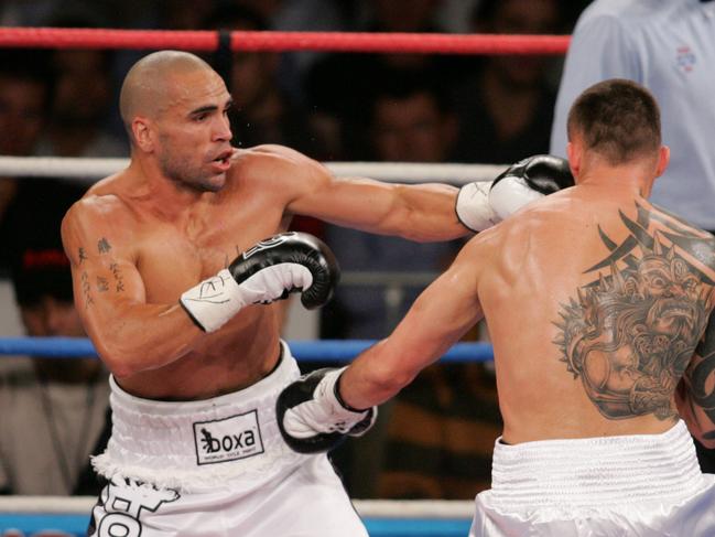 Anthony Mundine (left) battles Mikkel Kessler for the WBA super-middleweight title at the Sydney Entertainment Centre in 2005