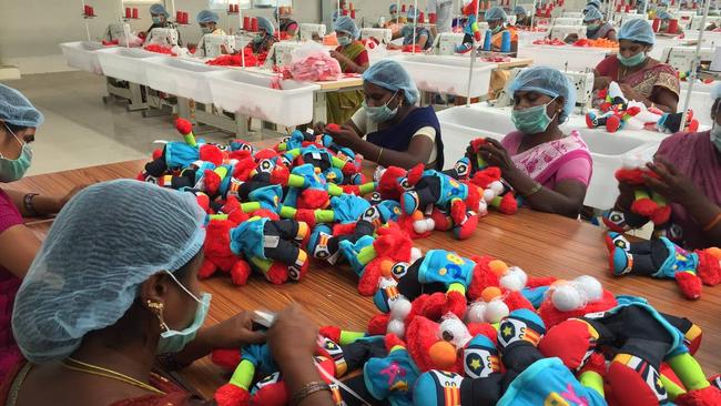 Workers assemble Elmo dolls for Hasbro at a factory in Kakinada, India.