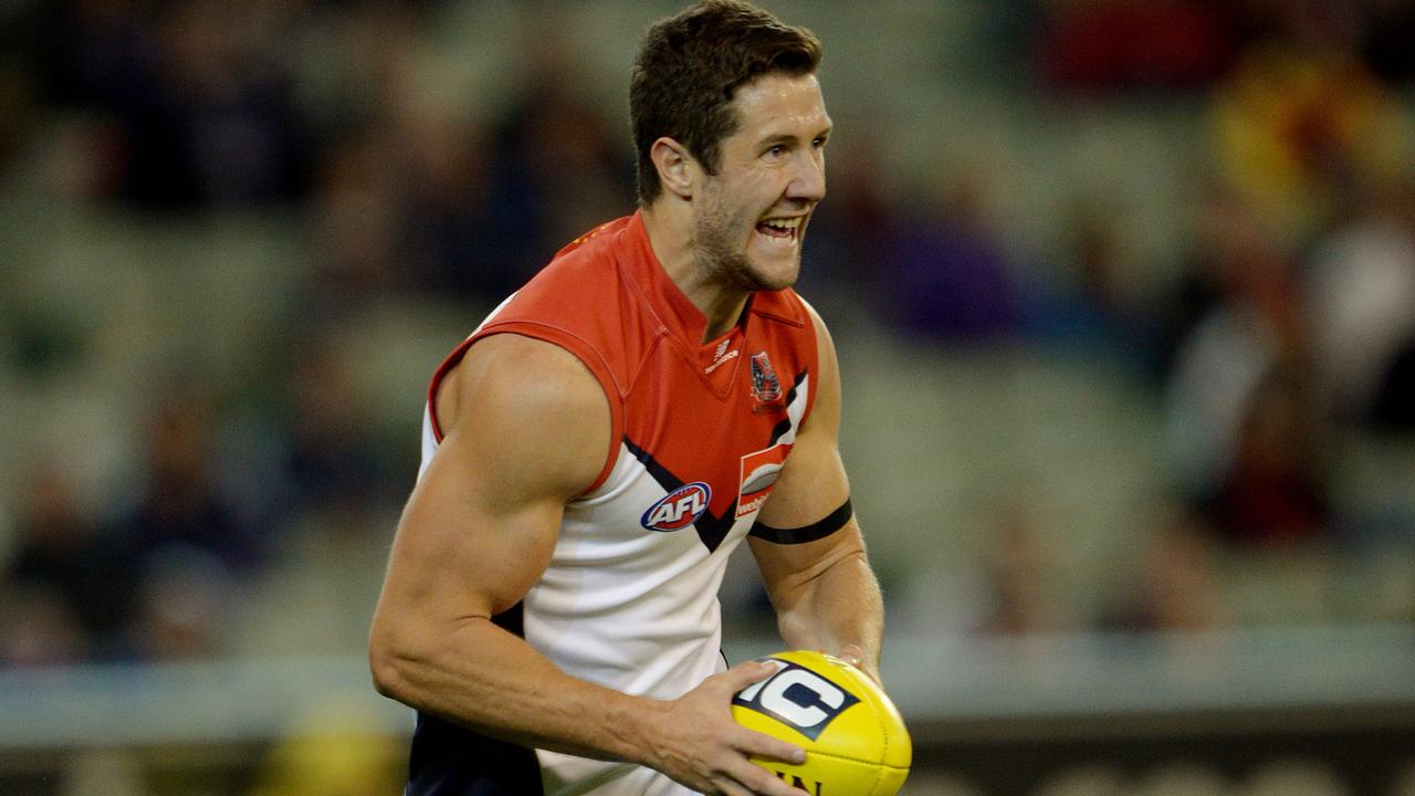 AFL Round 6: Carlton v Melbourne at the MCG Melbourne 5th April 2013, Dees James Frawley gets a kick away