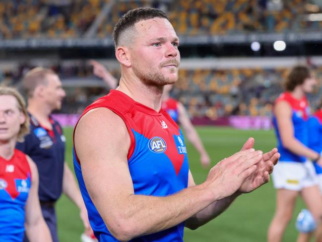 BRISBANE, AUSTRALIA - AUGUST 19: Steven May of the Demons acknowledges fans after the 2022 AFL Round 23 match between the Brisbane Lions and the Melbourne Demons at The Gabba on August 19, 2022 in Brisbane, Australia. (Photo by Russell Freeman/AFL Photos via Getty Images)